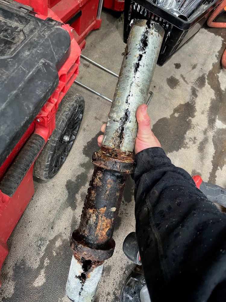 Corroded Pipe Removal — Failing galvanized supply line removed before replacement